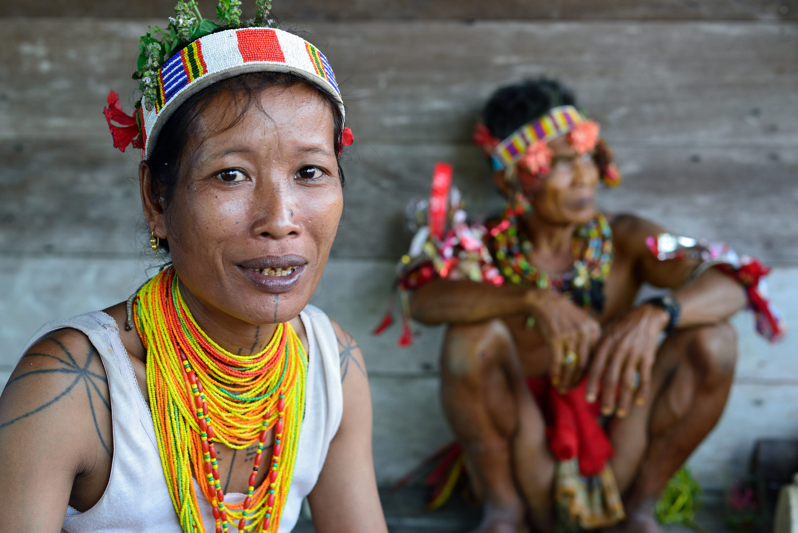 Portrait tribal woman - shaman, with traditional tattoos, at his rainforest home Uma, during the traditional ceremony for the protection of the clan