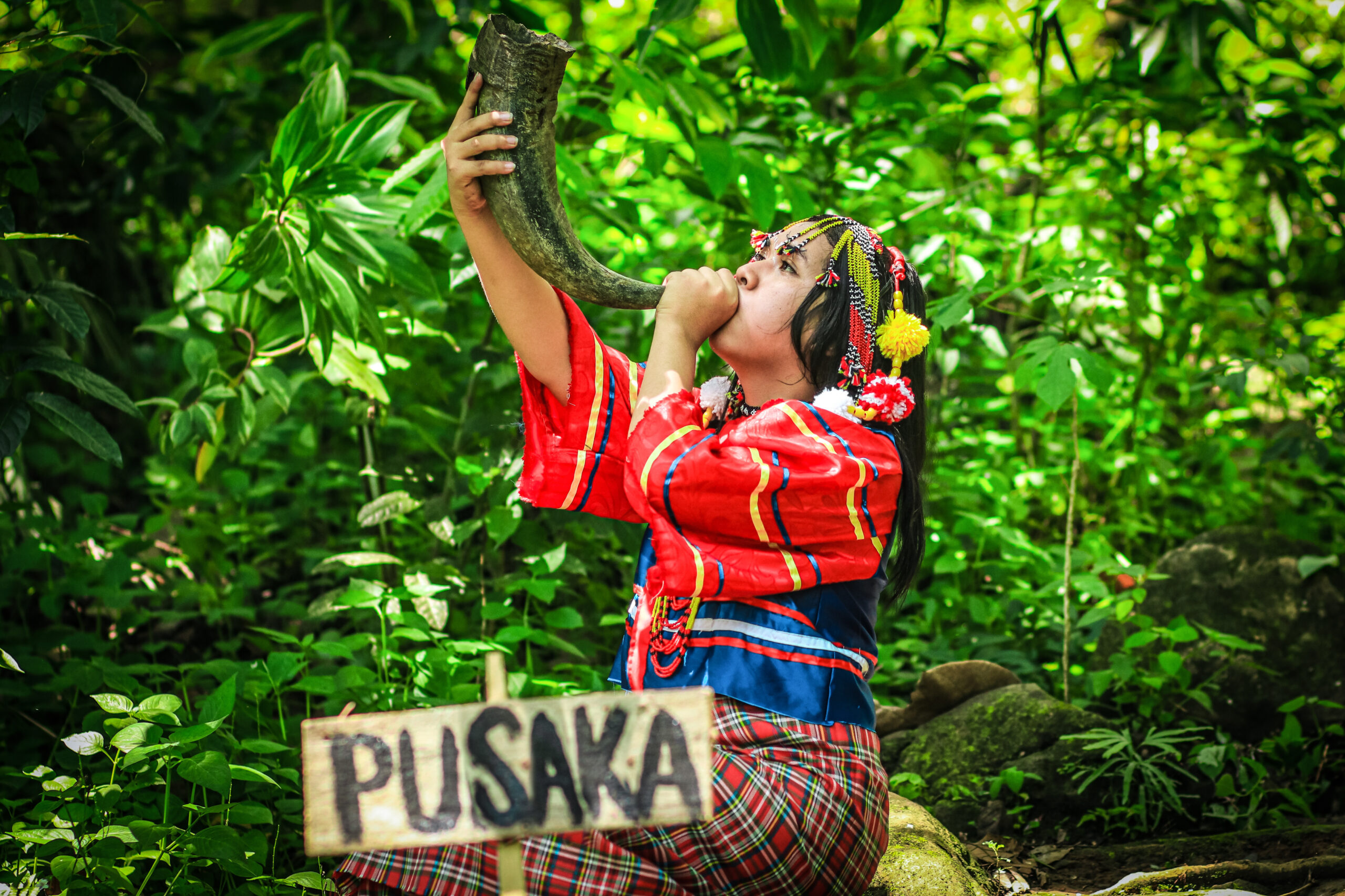 Young indigenous woman from the Obu Manuvu tribe of Indonesia holding a horn to call Pusaka, she is the spirit of the forest.
The “Indigenous Innovative Solutions” Photography Contest Winners
Name of the photograph: Pusaka. Author: Prince Loyd C. Besorio
